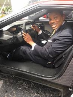 Smith posing with a car